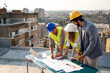 © NDABCREATIVITY - Group of engineers, architects, business partners at construction site working together
