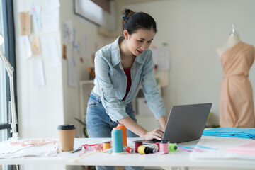 Wall Mural - Female entrepreneurs are making new clothing collections.