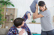 © auremar - happy couple are pillow fighting
