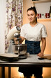 © fesenko - woman in kitchen with kitchen machine and rolling pin on table