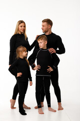 Wall Mural - Sports family in thermal clothes, on a white background.