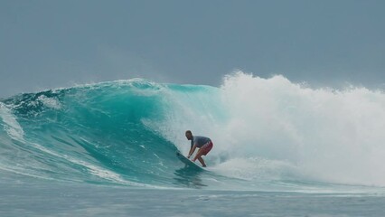 Poster - Surfer rides the big wave in the Maldives, Sultans surf spot during big swell day