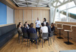 © Studio Romantic - Business trainers old man and young woman conduct training in office for group of people. Training aimed at improving the efficiency of office stuff in the company. Professional development concept.