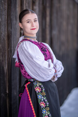 Young beautiful slovak woman in traditional costume. Slovak folklore