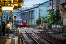 Tokyo Shitamachi Trolly Train (Toden) Station Platform And Woman Waiting