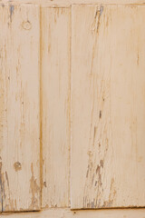 Wall Mural - Background, texture of a wooden painted door with peeling paint from cracks. Photo close-up, copy space.