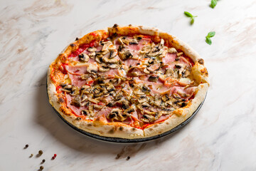 Wall Mural - Pizza with ham and mushrooms with tomato sauce on white marble table