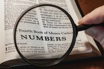 Wall Mural - title page book of Numbers close up using magnifying glass in the bible or Torah for faith, christian, hebrew, israelite, history, religion, christianity, Old Testament