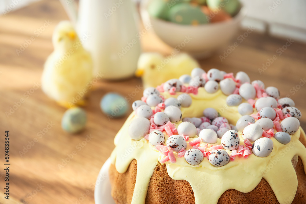Easter cake with painted eggs on kitchen counter, closeup