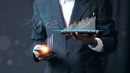 Wall Mural - planning analyze indicator and strategy buy and sell, Stock market, Business growth, progress or success concept. Businessman or trader is pointing a growing virtual hologram stock, invest in trading