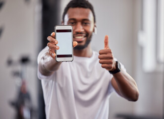 Poster - Phone screen, mockup and black man with thumbs up in gym for exercise or fitness. Sports, portrait and male athlete with smartphone for branding, advertising or marketing with hand emoji for success.