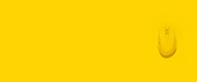 Yellow Wireless Computer Mouse On A Yellow Background. Top View, Flat Lay. Banner