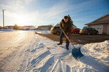 A Man Shovels Snow In Northern Alberta.