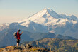 © Cavan Images - A Backpacker Checks His Phone While Hiking In North Cascades National Park