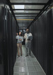 © Kirsten D/peopleimages.com - Laptop, teamwork or IT people in server room for maintenance, analysis or digital innovation. Data center, cybersecurity or man and woman programmer for planning network strategy or system firewall