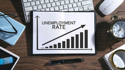 Sticker - Unemployment rate graph on notepad with a business objects.