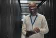 © Kirsten D/peopleimages.com - Server room, tablet or black man portrait or technician for data center, system and cybersecurity code. Happy male programmer or programming person in information technology or digital transformation