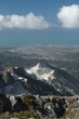 Carrara quarries. Marble quarries of the Apuan Alps.Panorama of the mountains with greenery over the city of Carrara. Carrara, Tuscany, Italy
