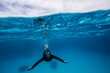 © RooM The Agency - Underwater view of a man swimming, Lady Elliot Island, Great Barrier Reef, Queensland, Australia