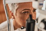 Laser, vision or senior customer in eye exam for eyesight at optometrist office in assessment or consultation. Face of mature woman testing or checking vision to help iris or retina visual health