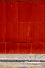 empty street and detail of a building in a city