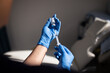 © Austockphoto - Close up shot of a syringe being inserted to a medicine glass vial by a healthcare worker