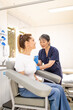 © Austockphoto - Female patient getting an injection on the arm by a female healthcare practitioner in a clinic