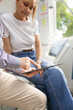 © Austockphoto - Male doctor holding a tablet  and talking to a female patient in the clinic