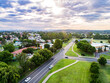 © Austockphoto - Single ray of light shining down over town of singleton on summer evening