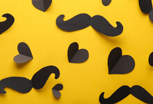 Paper Mustache With Black Hearts On Yellow Background. Valentine's Day, Love Concept