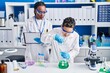 © Krakenimages.com - African american mother and son scientists measuring liquid laboratory