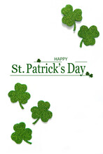 Happy St. Patrick's Day Banner.Holiday Background.St Patricks Day Frame Against A White Background. Flat Lay Shamrocks.Copy Space.Patrik's Day Banner