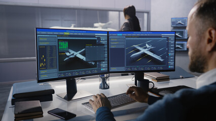 Engineers check aerodynamics of new development drone in laboratory for modern modifications using wind tunnel with steam. Computer system for changing parameters. Concept of manufacturing UCAVs.