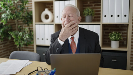 Poster - senior business worker tired working with laptop at office