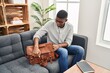© Krakenimages.com - Young african american man psychologist closing briefcase at clinic