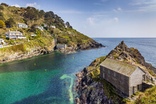 Polperro In South East Cornwall, With Its Restored Old Net Loft At The Entrance To The Harbour.