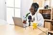 © Krakenimages.com - Young african american woman broadcaster smiling confident working at radio studio