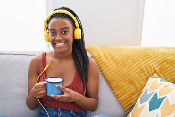 Sticker - African american woman listening to music drinking coffee at home