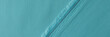 Light blue fabric with fringe and seam closeup