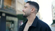 © Krakenimages.com - Young arab man smiling confident looking to the side at street