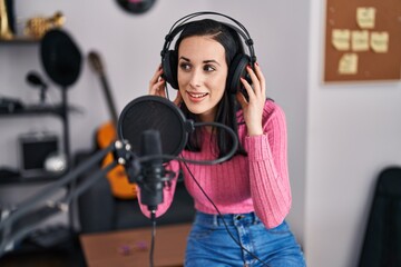 Sticker - Young caucasian woman musician smiling confident singing song at music studio