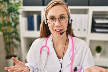 Sticker - Young blonde woman doctor having telemedicine at clinic