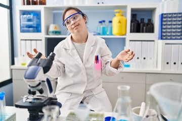 Sticker - Hispanic girl with down syndrome working at scientist laboratory clueless and confused with open arms, no idea concept.