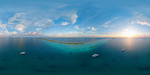 Wall Mural - Luxury yacht next to one of the atolls of the Maldives. Aerial seamless spherical 360 degree panorama