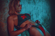 © chaossart - Young sexy fitness woman posing in dark interior