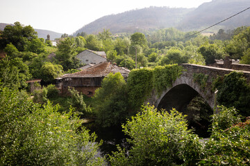 Wall Mural - Medieval bridge over Lor river in Barxa de Lor village (A Ponte), Quiroga \ A Pobra do Brollón, province of Lugo, Galicia, Spain - June 2022