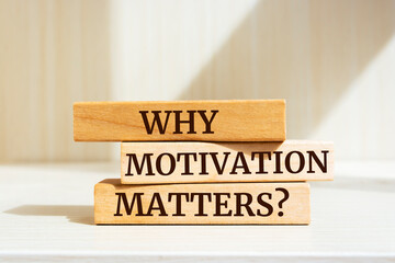 Wall Mural - Wooden blocks with words 'WHY MOTIVATION MATTERS?'.