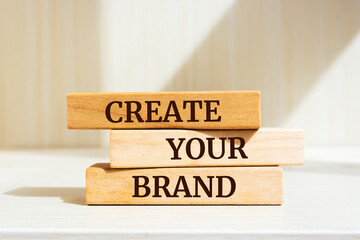 Poster - Wooden blocks with words 'Create your brand'.