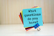 © Uuganbayar - What questions do you have? written on a memo at the office