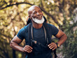 © Mumtaaz D/peopleimages.com - Nature, backpack and senior black man hiking in a forest for exercise, health and wellness. Sports, athlete and happy elderly African male hiker in retirement trekking in the woods on adventure trail
